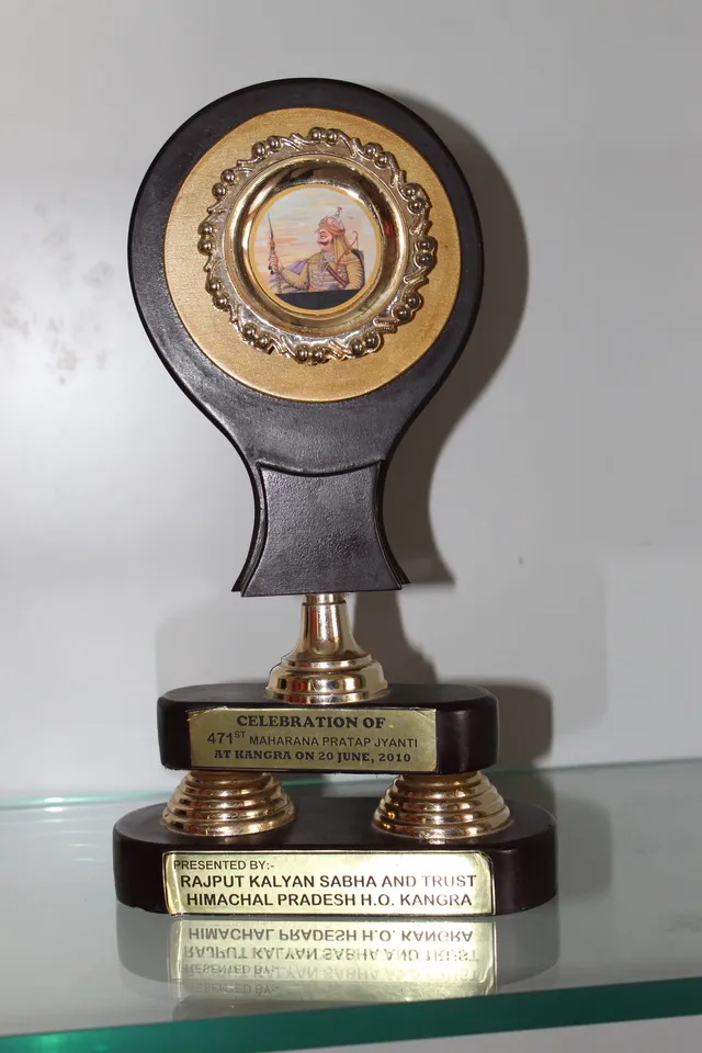 Photograph 20 of 28 from Thakur Ramsingh Ji's personal archive: his belongings and memorabilia on display shelves.