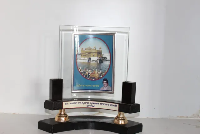 Photograph 23 of 28 from Thakur Ramsingh Ji's personal archive: his belongings and memorabilia on display shelves.